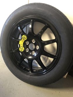 20” black Range Rover rim with spare tire