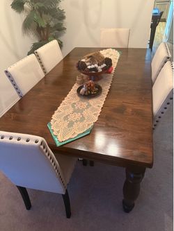 Formal  dinning set with a solid wood table and (6) six chairs