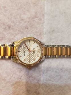Good condition... Authentic two tone coach watch. Beautiful gently Worn Two tone women's coach watch