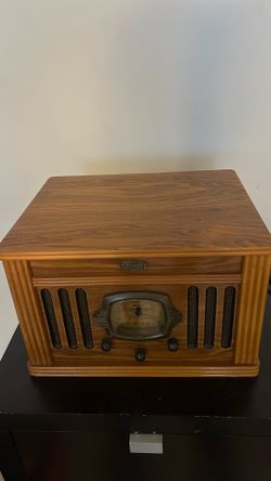Beautiful Crosley wooden cabinet with a classic vintage design.