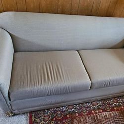 Free grey sofa, small corner tears on bottom