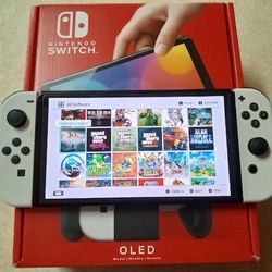 NINTENDO SWITCH OLED with 125 SWITCH GAMES and Over 7500 RETRO GAMES