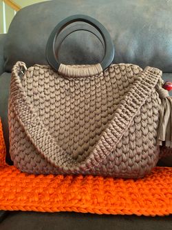 Handmade crochet bag with wooden handles and internal organizer