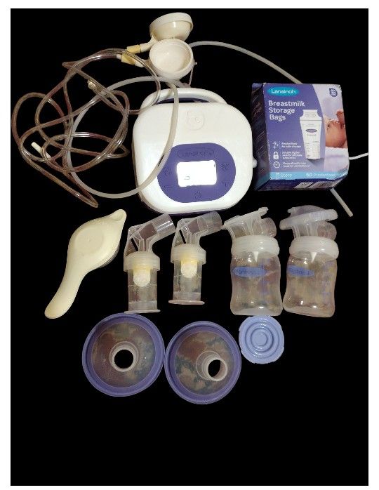 2.0 breast pump with a accessories in working order