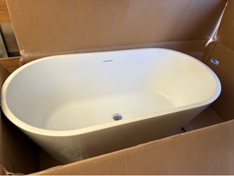 Freestanding soaking bath tub