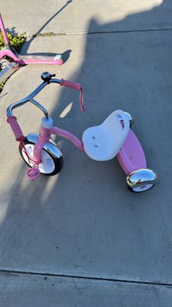Pink Radio Flyer tricycle