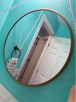 Gold round mirror