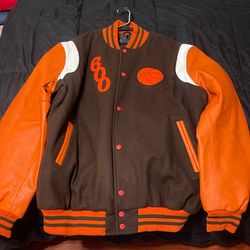 Orange, white and brown jacket.