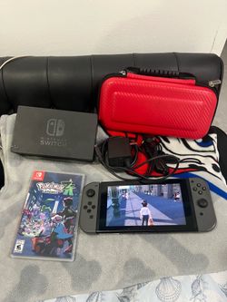 I'm selling a Switch console in like-new condition with its accessories, plus a physical copy of the *Pokémon Legends: Arceus* game.