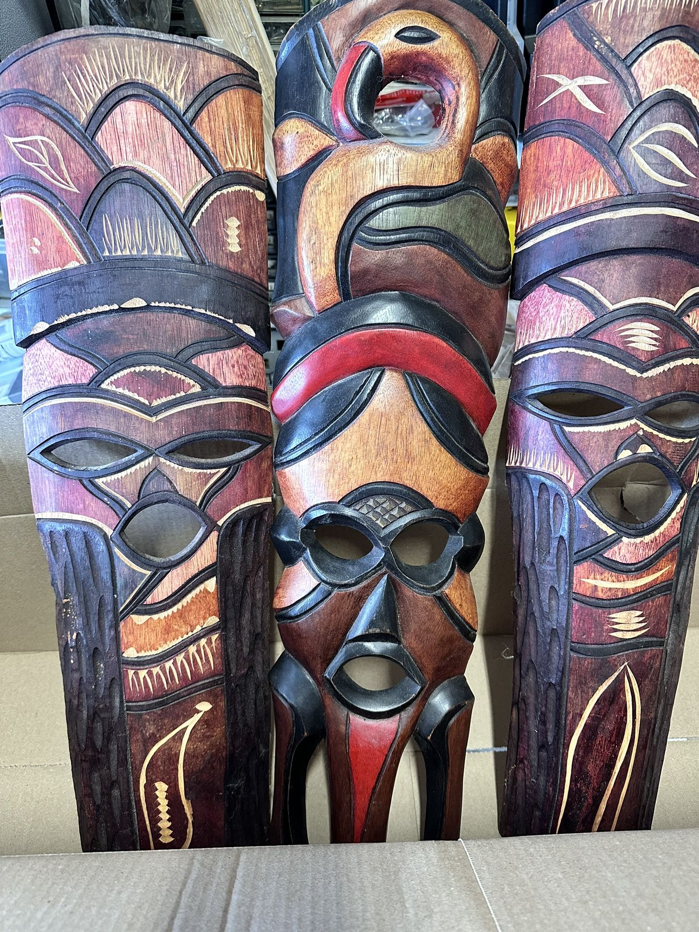 Wooden Face Masks And Flower Arrangements