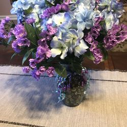 Fake plant with glass vase