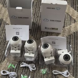 SET OF 4 WIRELESS WIFI SECURITY COLOR CAMERAS CAN TILT SWIVEL ROTATE ZOOM AND RECORD 24/7. RECEIVE NOTIFICATIONS ANYWHERE IN THE WORLD THROUGH WIFI