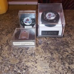 avalanche player pucks   1 authenticated  Dan hinote  2 not player  Adam deadmarsh and Adam foote