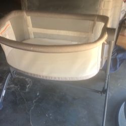 Baby Delight Beside Me Dreamer Bassinet & Bedside Sleeper.  This bassinet can be used in two modes: as a standalone bassinet with br