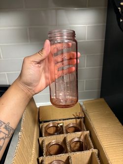 Pink glass juicer bottles with lids