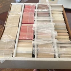 box full of baseball and football cards