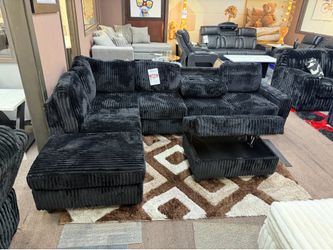 Black sectional and ottoman