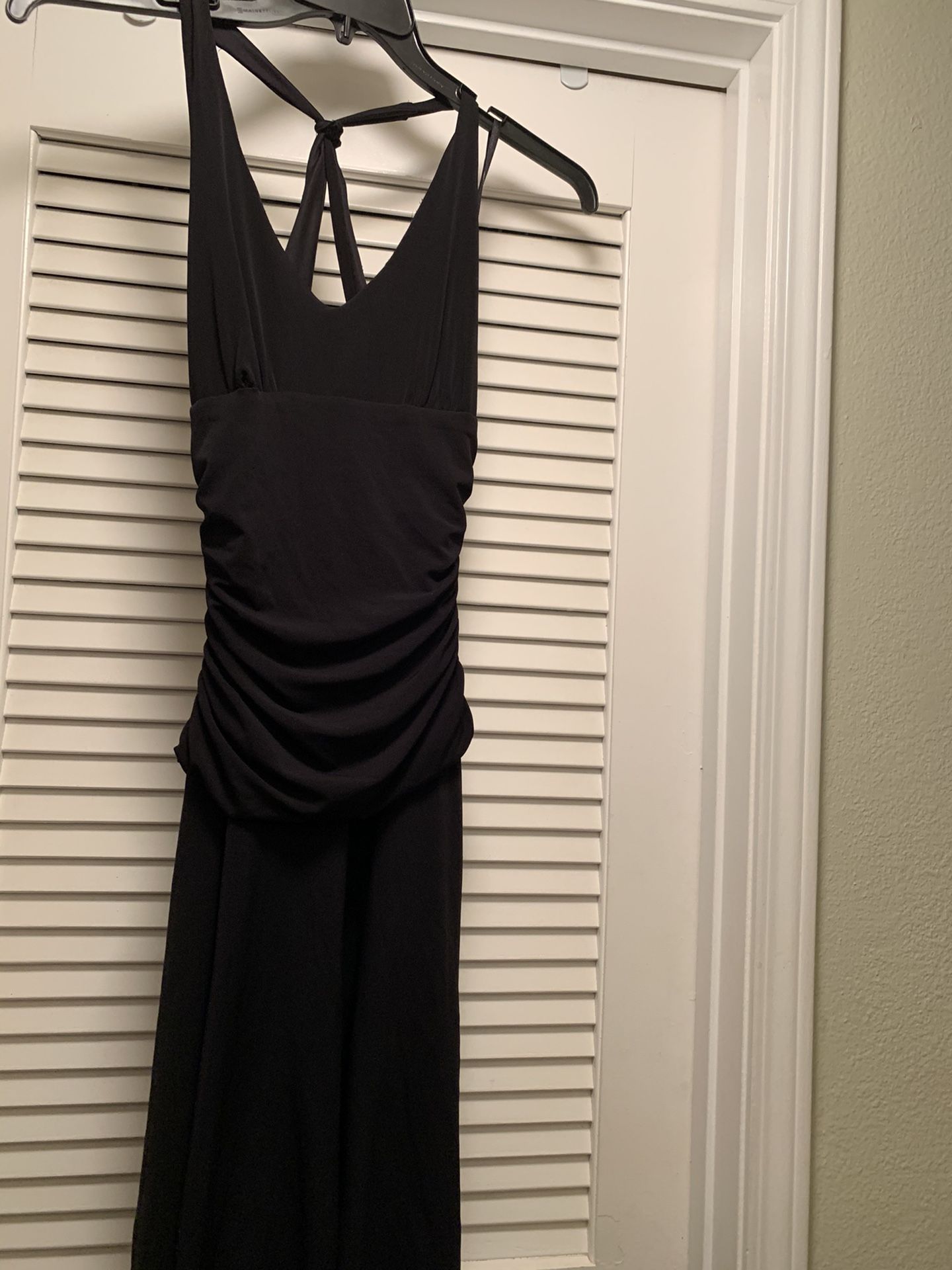 Cute little black dress. Soft material. Size small. Halter style back.