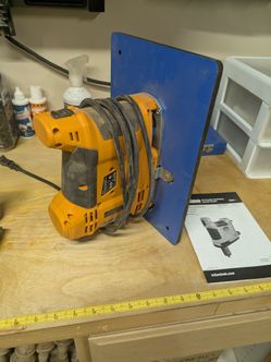 Triton Portable Oscillating Spindle Sander and router table insert.