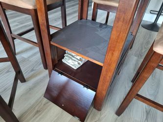 High table with chairs and fireplace