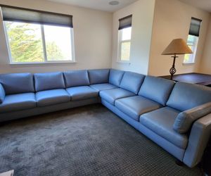 Beautiful stressless blue leather sectional originally over $10,000
