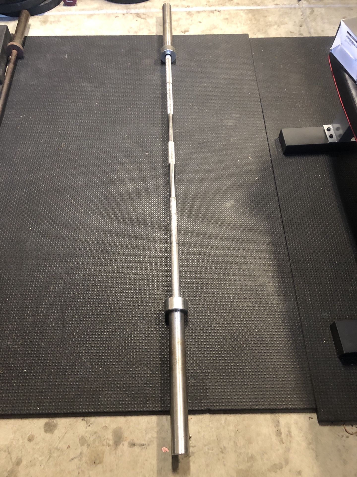 45lbs Barbell(Chinese) and 2- 35lbs metal plates for sale.