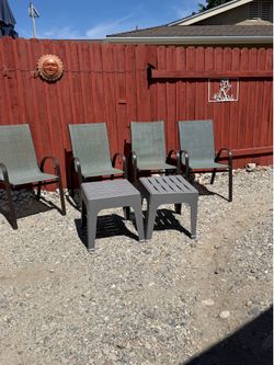 Beautiful Patio set 4 Chairs 2 Small plastic tables.
