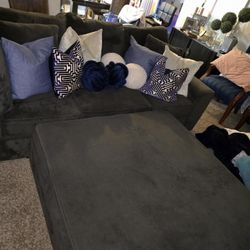 Couch and pictures, curtains, and decorative pieces