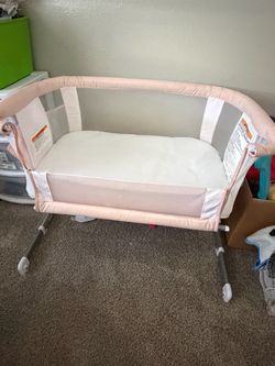 Pink baby bassinet