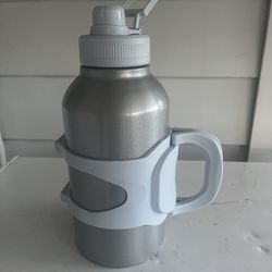 Double wall insulated stainless steel bottle with leak proof, sports lid and caring handle 90 ounce