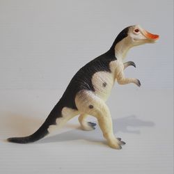 Dinosaur action figure with the words Hanrosaurus Made in China under 5" Tall. 

