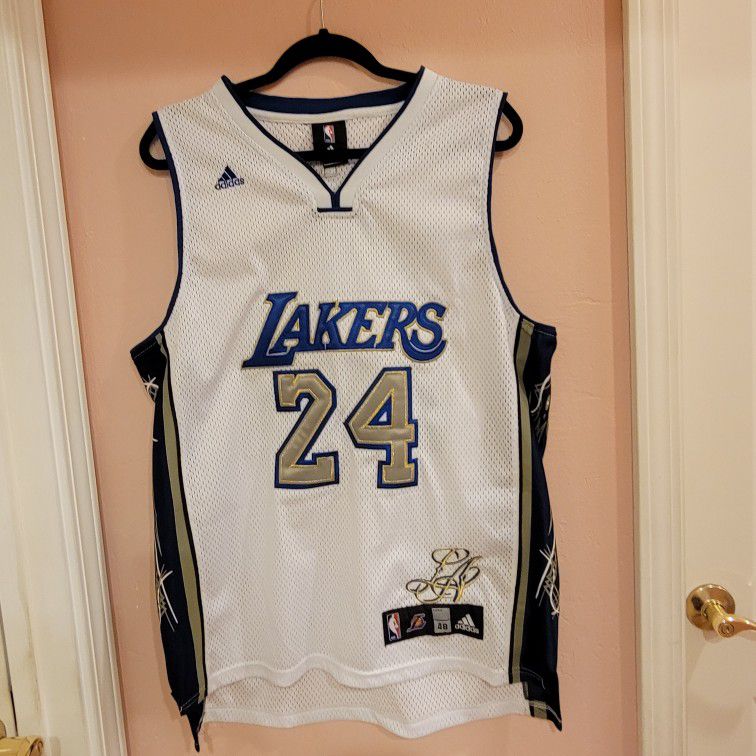 Very rare Kobe Bryant #24 Los Angeles Lakers Adidas Jersey 
White/Blue/Gold. Size 48. Perfect shape, like new