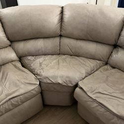 Beige Leather Sectional Recliner/Bed