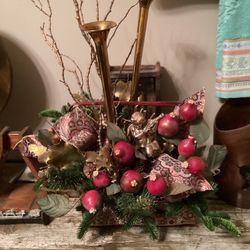 Christmas arrangement in red ribbon-wrapped handled basket, 2 brass bugles, angel, pomegranates  24”T x 30”L- great condition!! (see photos)