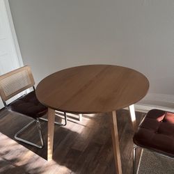 Circular dining table