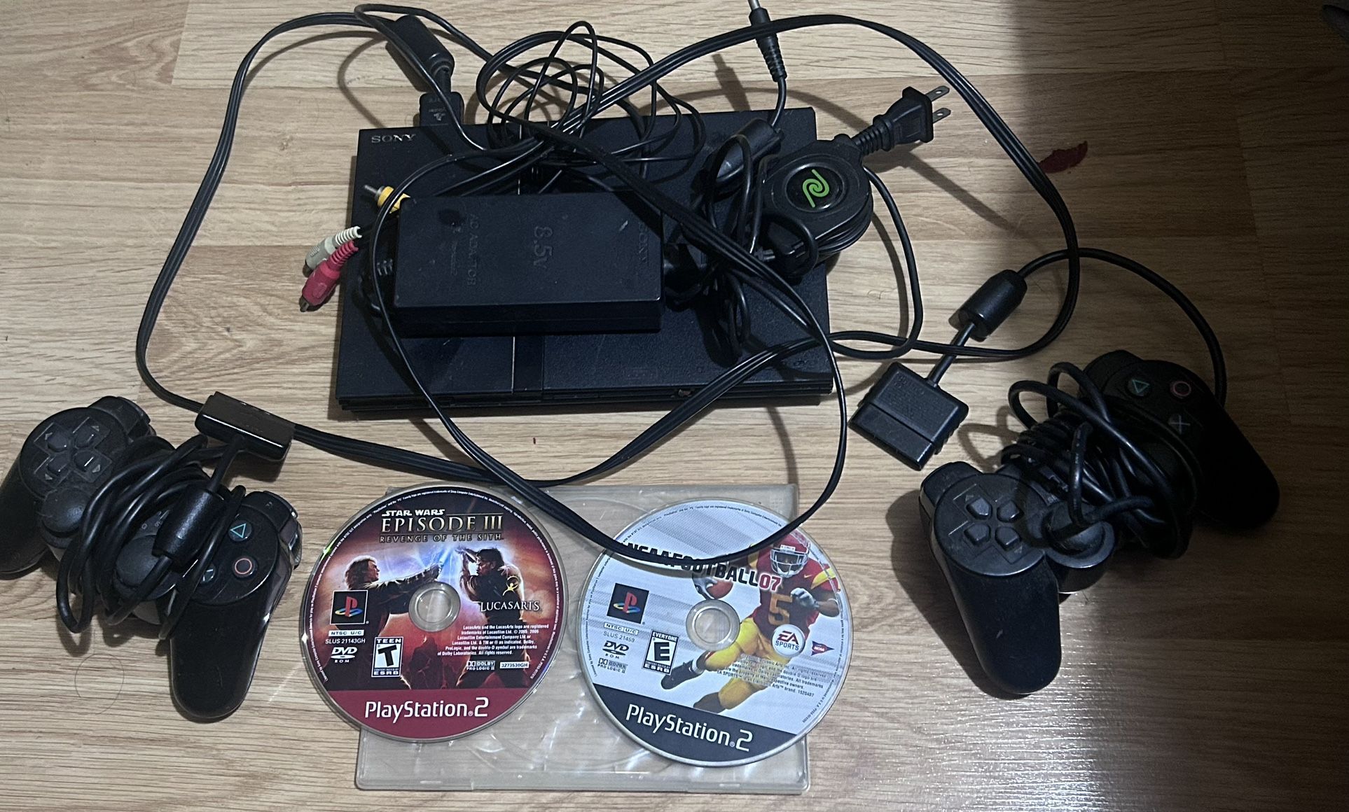 Sony PS2 with games (Revenge Of The Sith and NCAAFOOTBALL07)