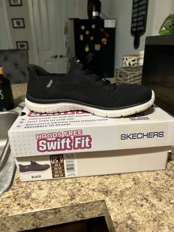 Woman’s black sketcher’s