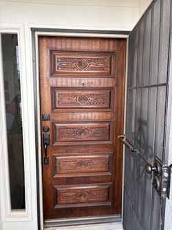 Front wood exterior door with carving