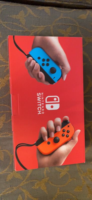 Nintendo Switch Brand New with Red and Blue Joycons
