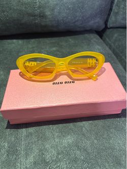 Miu Miu yellow sunglasses