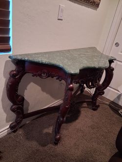 I have a nice wall table , very good top carved wood