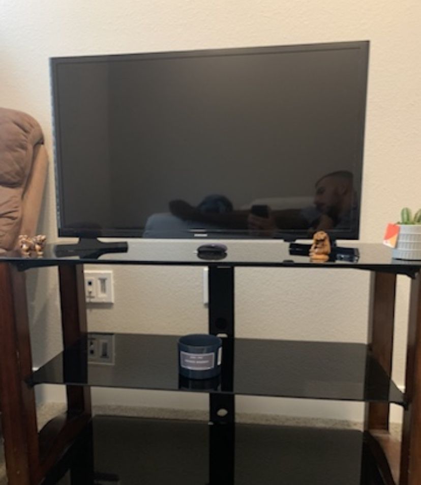 Samsung TV (comes with Roku, stand, and remotes)
