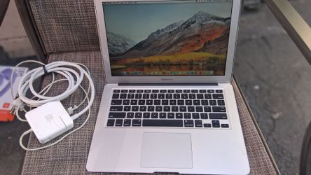 Apple MacBook Air A1466 with charger. No cosmetic damage.