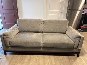 Like new couch has a small tear