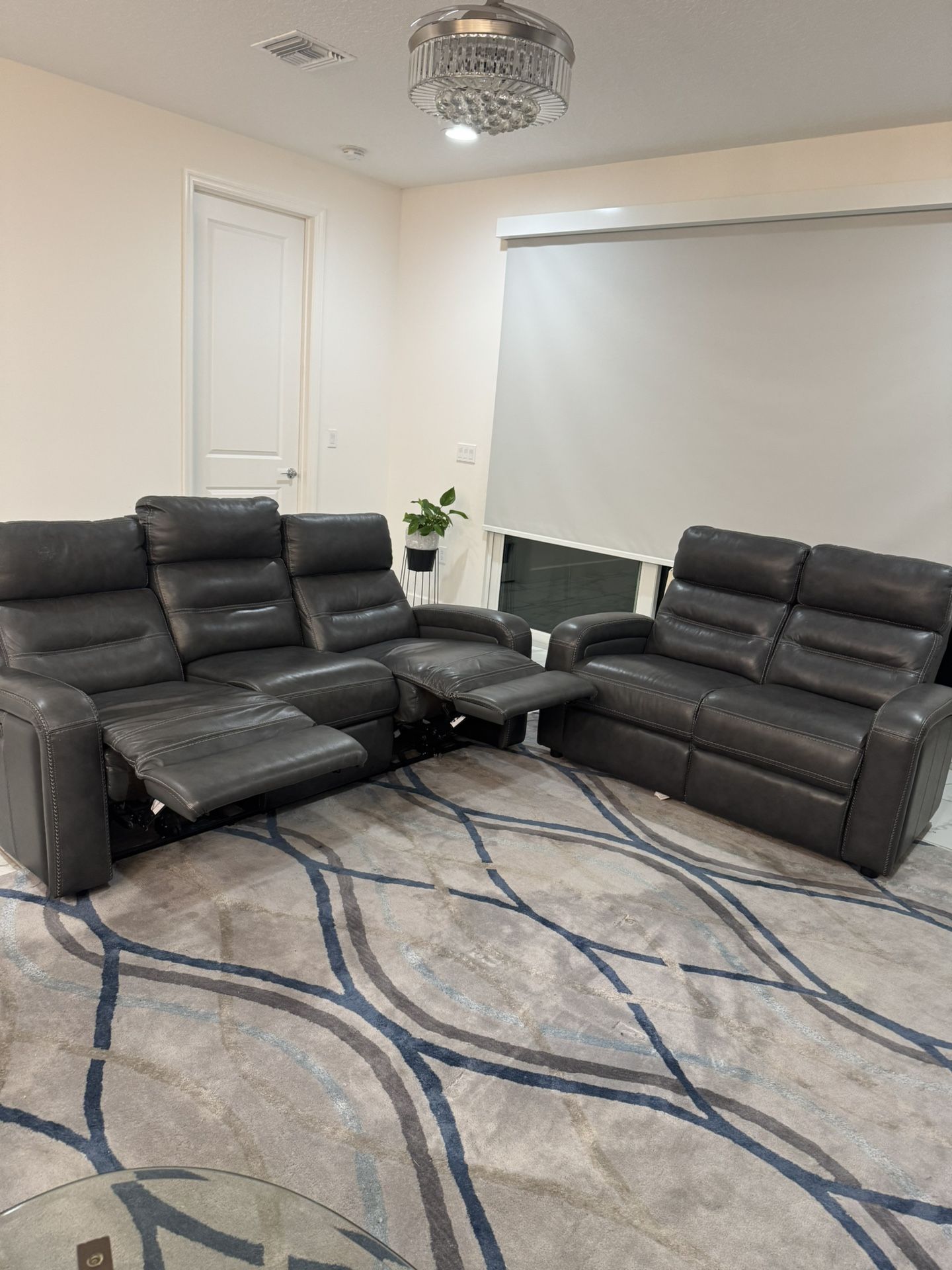 Love seat  and  dual power recliner sofa grey color leather 