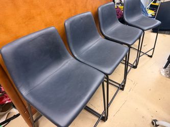 4 navy blue leather chairs
