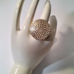 A Beautiful Gold Colored Ring One Size Fits Most .