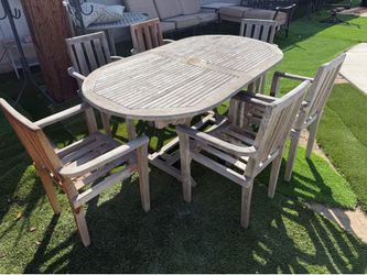 Patio teak set with 6 chairs and 1 leaf underneath