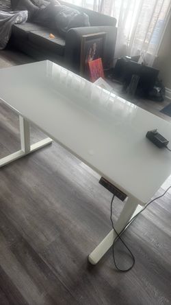 Adjustable glass desk