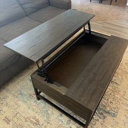 Dark wood lift-top coffee table with storage.